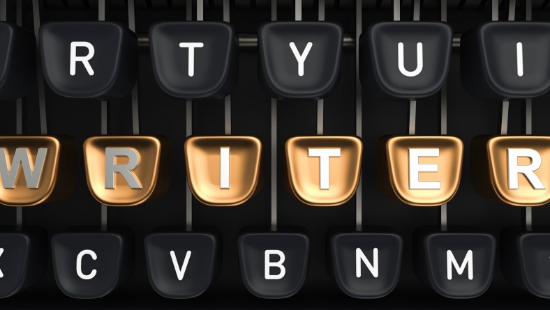 Typewriter with gold buttons in a row, assembling WRITER word