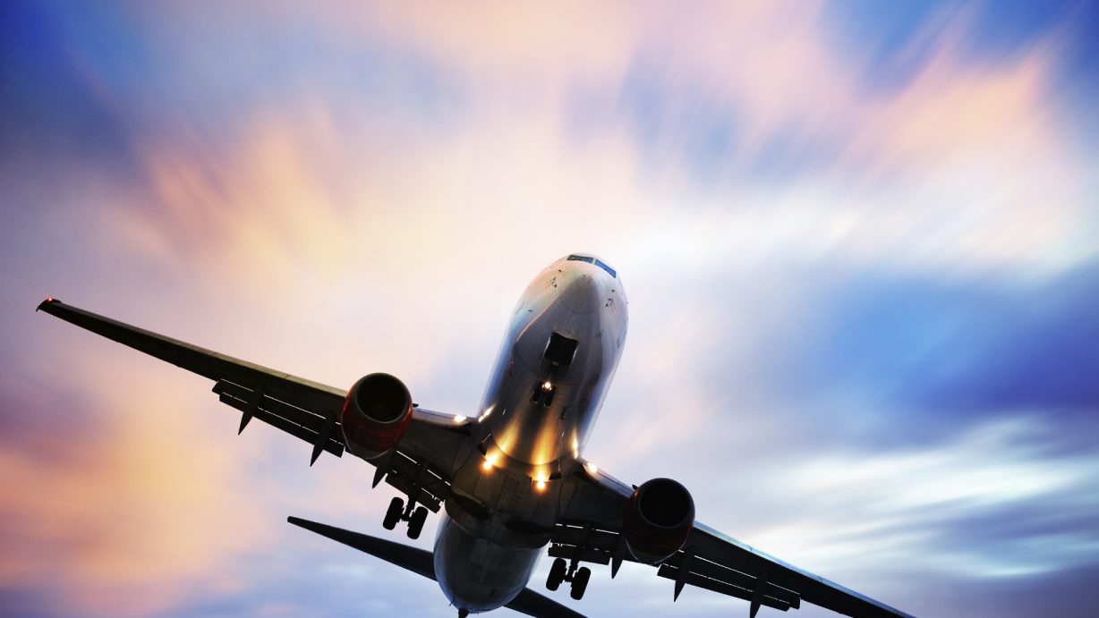 Airplane-taking-off-against-blue-and-pink-sky1